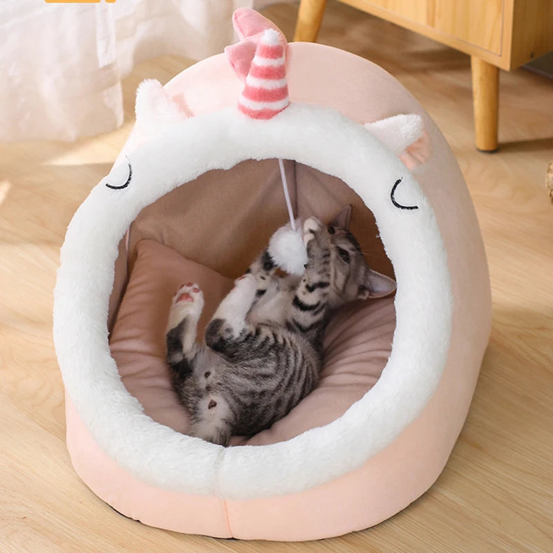 front image of pink color Unicorn Cozy Cat House with cat inside