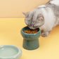Dark Green Ceramic Elevated Pet Bowl with Cat Eating Front Image