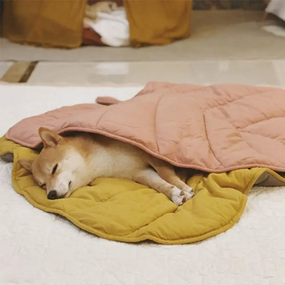 front image of dog sleeping between two Leaf Shape Pet Blankets