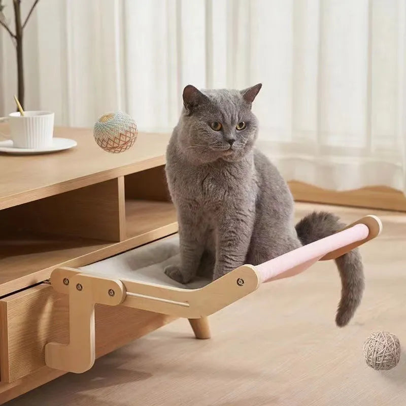 front image of cat sitting on Sturdy Wooden Hanging Cat Bed