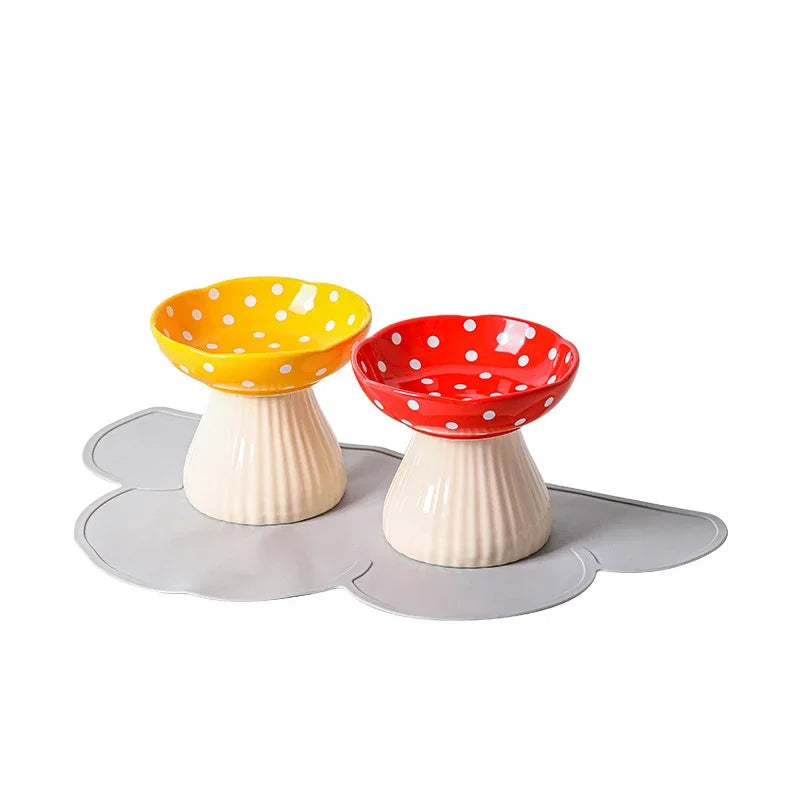 front image of yellow and red colors Mushroom Ceramic Elevated Cat Bowls with mat