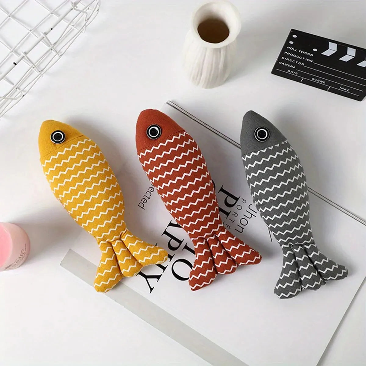 top image of three different colors Chewy Fish Interactive Cat Toys