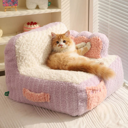 front image of purple color Cake Sofa Cat Bed with cat lying on it
