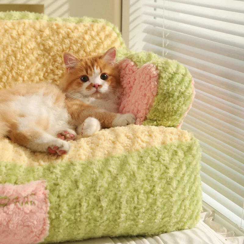 close up image of green color Cake Sofa Cat Bed with cat lying on it